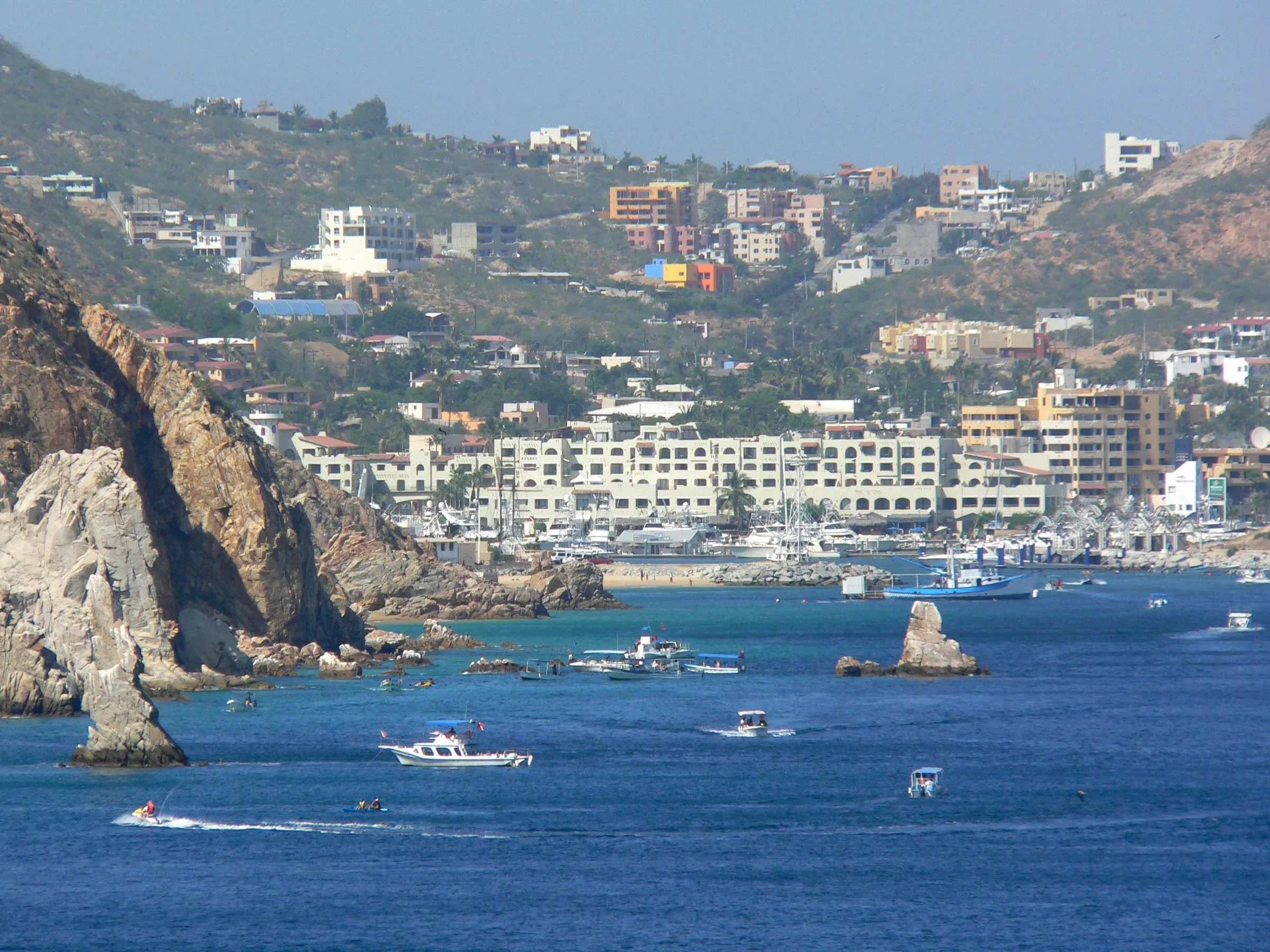 The bay at Cabo San Lucas, boats at anchor under the granite headland